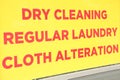 dry cleaning regular laundry cloth alteration writing caption text sign in red. ph