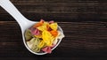 Dry colorful Italian pasta farfalle or bows in spoon Royalty Free Stock Photo
