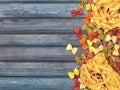 Dry colorful Italian pasta fettuccini and farfalle or bows border background Royalty Free Stock Photo