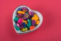 Dry colorful play dough in heart shaped bowl Royalty Free Stock Photo