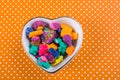 Dry colorful play dough in heart shaped bowl Royalty Free Stock Photo