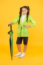 Dry and comfortable in rainy weather. small girl in raincoat with umbrella. schoolgirl waterproof raincoat. in good mood Royalty Free Stock Photo