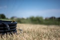 Coil of 1 inch irrigation tubing ready for new installation on top of brown and damaged dry grass. Royalty Free Stock Photo