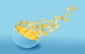 Dry corn flakes in a blue ceramic plate, some of the corn flakes are flying in the air. traditional cornflakes breakfast concept Royalty Free Stock Photo