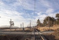 Dry Countryside with Rural Gravel Road Crossing Railway Tracks