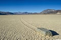 dry cracked desert showing mysterious wandering rock, the racetrack, death valley, california