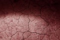 Dry cracked earth red Mars ground texture with spot light. No watering desert. Royalty Free Stock Photo