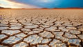 Dry Cracked Earth Texture Under Bright Sunlight in Nature Landscape Royalty Free Stock Photo