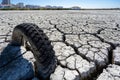 dry and cracked floor of the dry river of the big boiler in the city of Barreiro with buried old car tire