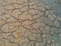 Dry cracked mud texture with deep crevices