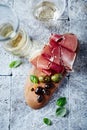 Dry cured ham, marinated olives and white wine Royalty Free Stock Photo