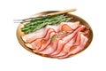 Dry cured pork Black Forest Ham bacon with rosemary. Isolated on white background. Top view. Royalty Free Stock Photo