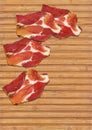 Dry Cured Pork Neck Slices Set On Rustic Bamboo Place Mat