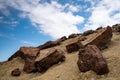 Dry deserted land of an abandoned copper mine and blue cloudy sky