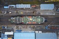 Dry dock and ship with shipbuilding in construction activity aerial view from above Greenock UK Royalty Free Stock Photo