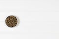 Dry dog pet food on white wooden background top view Royalty Free Stock Photo