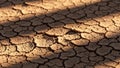 Dry earth forms a pattern of irregular polygonal shapes indicativ Royalty Free Stock Photo