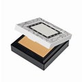 Dry face powder in square silver black casket isolated on white