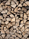 Dry firewood stacked in a pile, chopped wood for winter heating fuel of the fireplace. Royalty Free Stock Photo