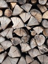 Dry firewood stacked in a pile, chopped wood for winter heating fuel of the fireplace. Royalty Free Stock Photo