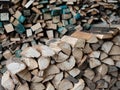 Dry firewood stacked in a pile, chopped wood for winter heating fuel of the fireplace. Royalty Free Stock Photo