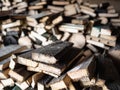 Dry firewood stacked in a pile, chopped wood for winter heating fuel of the fireplace. Royalty Free Stock Photo