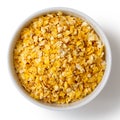Dry flaked corn in white ceramic bowl. Royalty Free Stock Photo