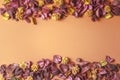 Dry flowers composition on colorful background. Border frame made of dried flowers and leaves. Top view, flat lay. Royalty Free Stock Photo