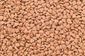 Dry food for cats or doggs - kibble. Organic texture background
