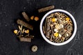 Dry food for rodents in bowl dark background top view Royalty Free Stock Photo