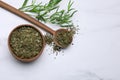 Dry and fresh tarragon on white table, flat lay. Space for text Royalty Free Stock Photo