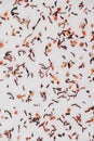 Dry fruit tea randomly scattered on a white table background. Top view. Copy, empty space for text Royalty Free Stock Photo