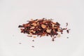 Dry fruit tea scattered on a white table background. Copy, empty space for text Royalty Free Stock Photo