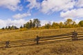 Dry golden rangeland and wood fence