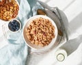 Dry granola in bowl. Sun beam, hard light, early morning. Breakfast, healthy diet food Royalty Free Stock Photo