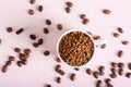 Dry granules of instant coffee in a cup on a pink background top view Royalty Free Stock Photo