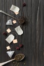 Dry green and black tea, tea bags on a dark background top view