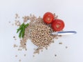 Dry green peas with tomato on white background.