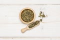 Dry green tea on grey wood Royalty Free Stock Photo