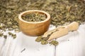 Dry green tea on grey wood Royalty Free Stock Photo