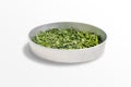 Dry healing mint leaves on a metal bowl isolated on white background. Seasoning Peppermint on a round tray Royalty Free Stock Photo