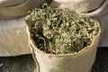 Dry herbal plants in sacks in sacks