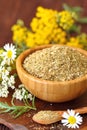 Dry herbal tea in wooden bowl Royalty Free Stock Photo