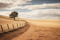 The dry hills look like sand dunes with a lone tree and a fence on the farm. A concept reflecting global warming or climate change