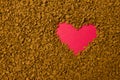 Dry instant coffee granules in the shape of a heart - brown texture