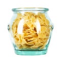 Dry Italian pasta macaroni bows farfalle in glass jar isolated on white background Royalty Free Stock Photo