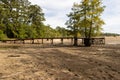 Dry lake bed with debris and fishing pier Royalty Free Stock Photo