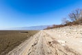 Dry lake bed with natural texture of cracked clay in perspective Royalty Free Stock Photo