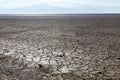 Dry lake bed with natural texture of cracked clay in perspective Royalty Free Stock Photo