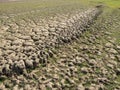 Dry land in a dry reservoir due to global warming Royalty Free Stock Photo